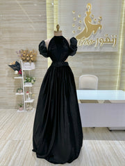 A stunning gold, off-the-shoulder maxi dress with a flowing skirt, perfect for a summer evening party.